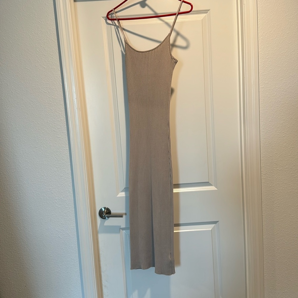 Tan spaghetti strapped sweater dress.
